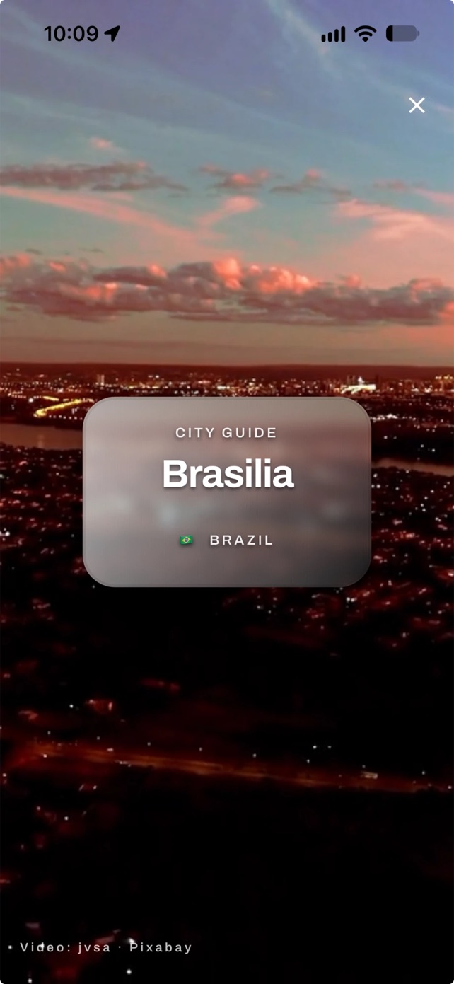 The Brasília city guide opening on a night-time film of the city with an Open guide button